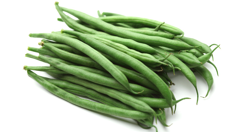 Fresh green beans on a white background