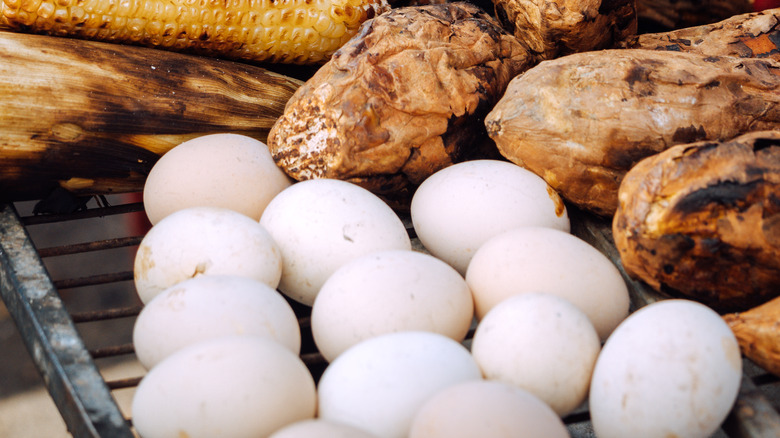 eggs and other food on a grill