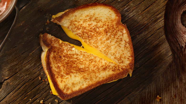 grilled cheese on wood board