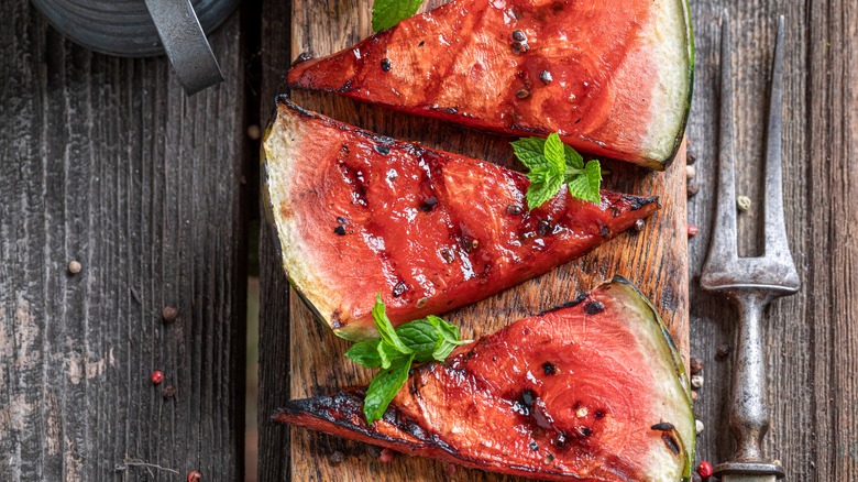 Grilled watermelon on a wooden board