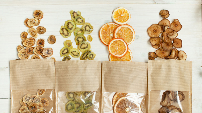 Dehydrated fruit slices spilling from bags