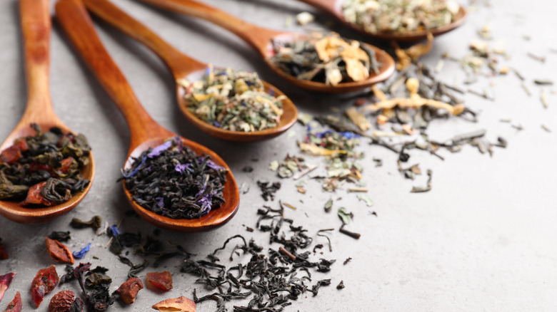 spoons of different tea leaves