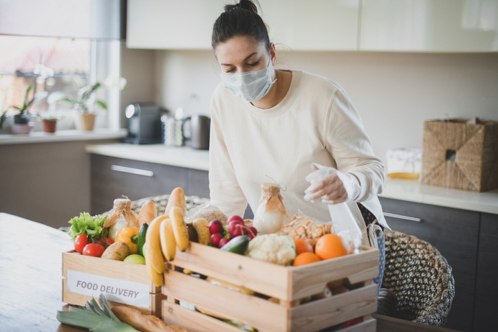 People are disinfecting deliveries before handling them