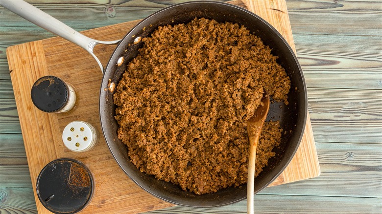 Skillet with cooked ground meat 