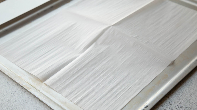 baking sheet lined with white paper