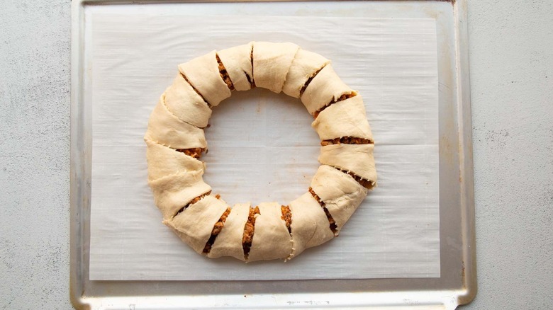 uncooked dough ring on baking sheet