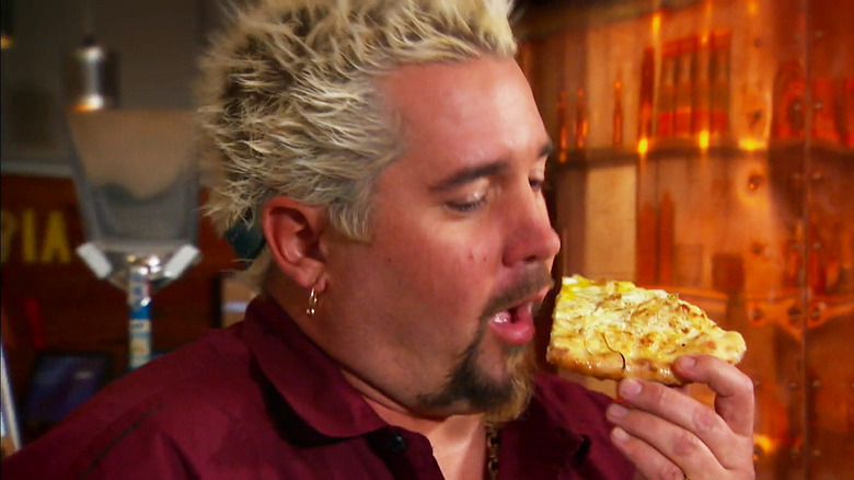 guy fieri eating egg pizza