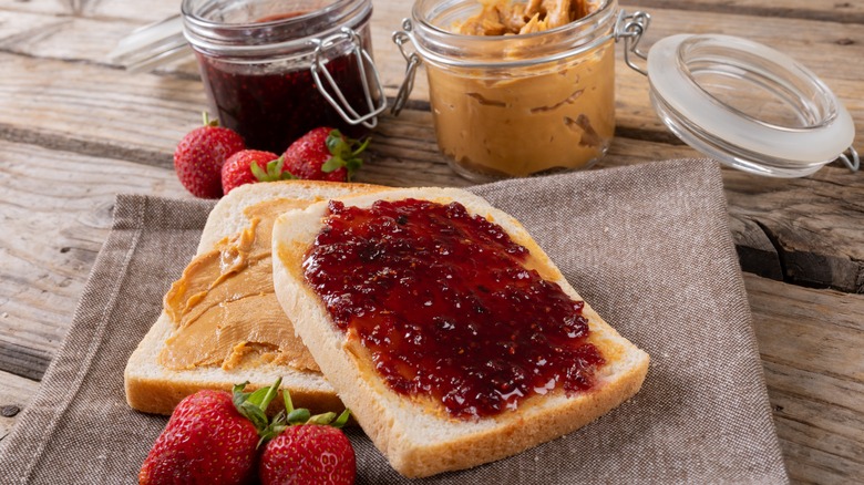 separated peanut butter and jelly slices of bread