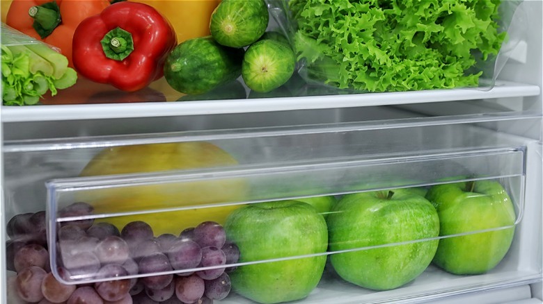 fruits and vegetables separated in fridge