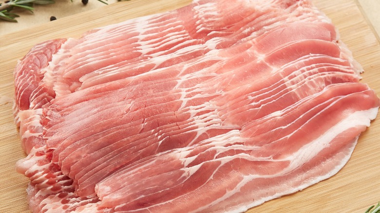 Bacon slices on a wooden board