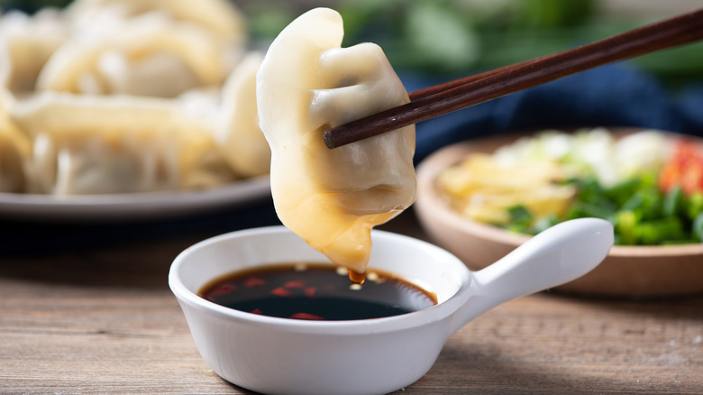 steamed dumplings in chopsticks
