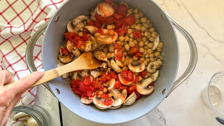 hand stirring pot of ingredients