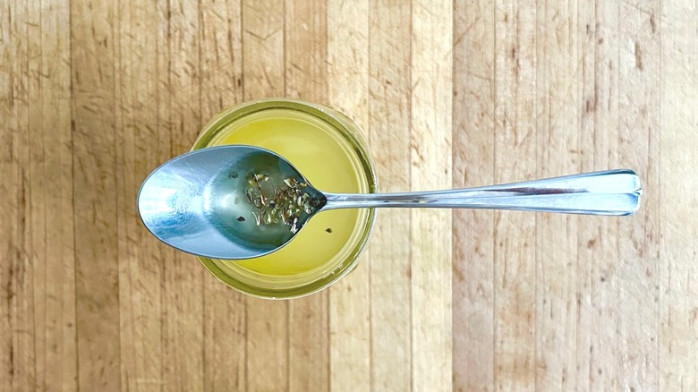 Spoon of herb-infused oil