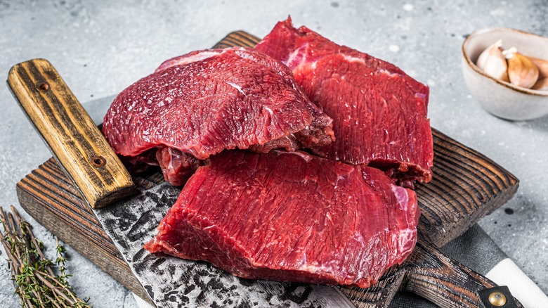 raw venison on cutting board