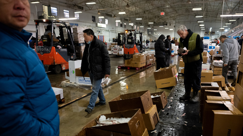 staff and customers inside a fish market