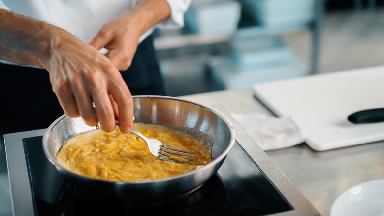 Chef makes french omelet