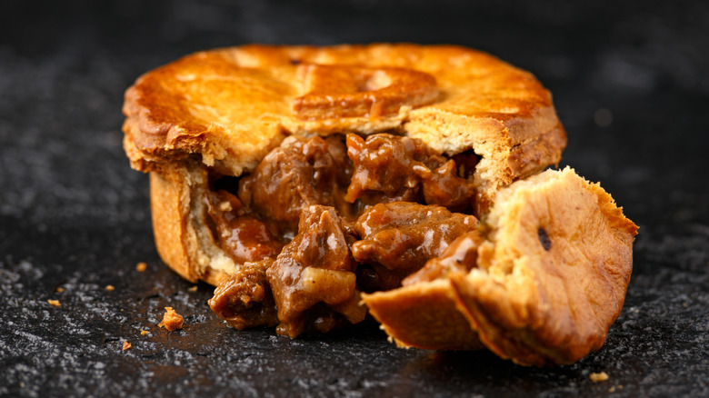 Meat pie with filling exposed