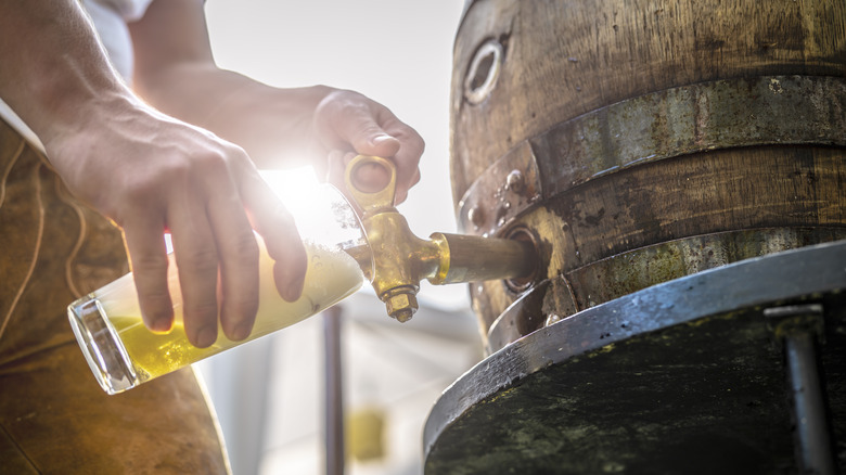 pouring beer from keg