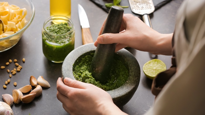 Person making pesto