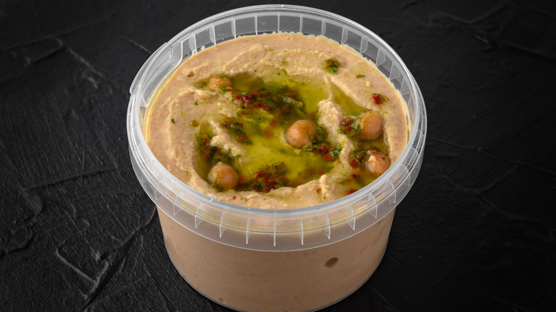 An open container of hummus