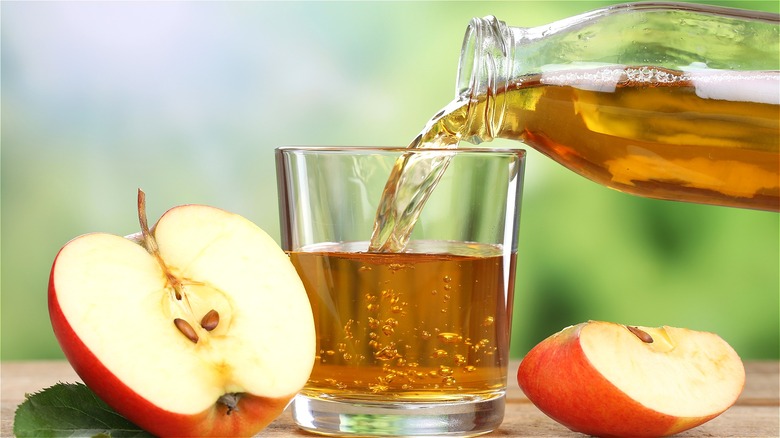 Apple juice poured into glass