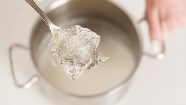 gelatin sheets being dissolved in water