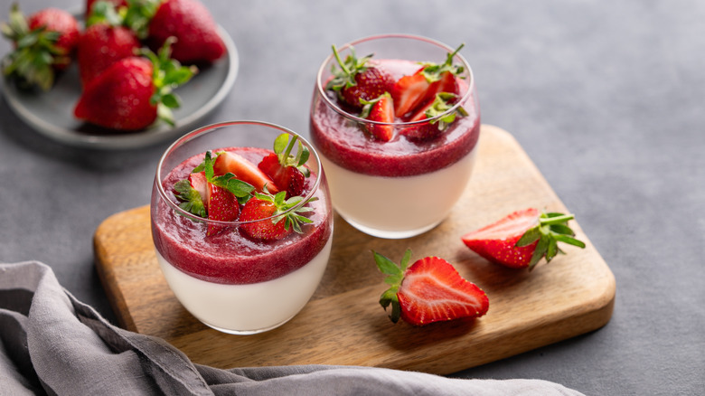 panna cotta with strawberries in glass serving cups