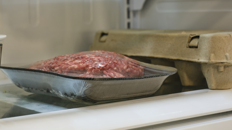 Ground beef on refrigerator shelf