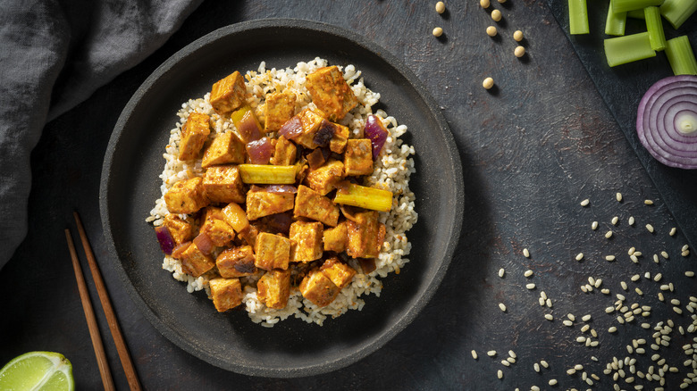 Crispy tofu on dark background