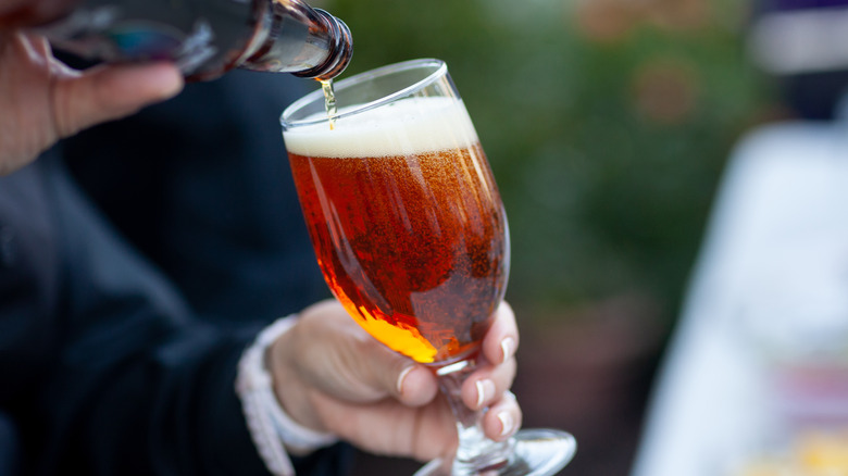 pouring bottle of beer