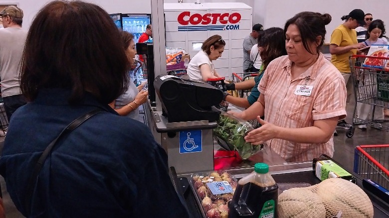 costco cashier checking out customer