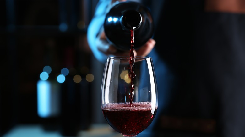 Red wine being pored in glass