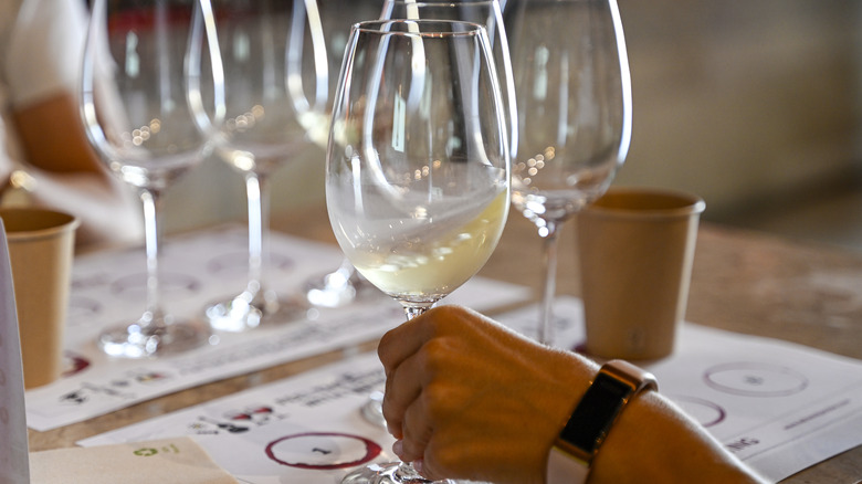 Person swirling glass of wine