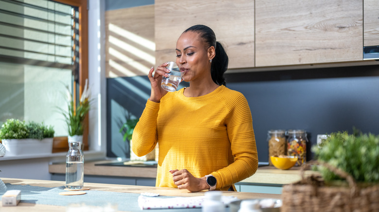 woman drinking glass of water