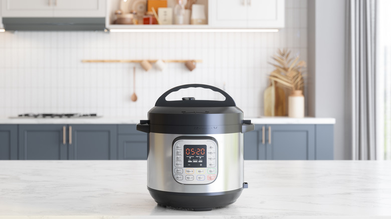 mini slow cooker on a counter in a kitchen