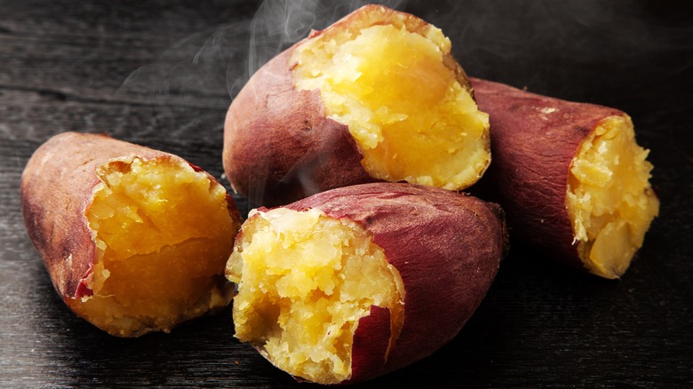 Baked potatoes broken in half