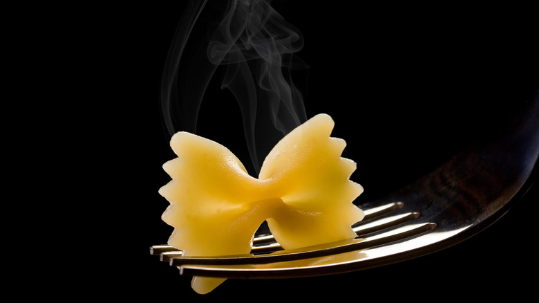 steaming bowtie noodle on fork