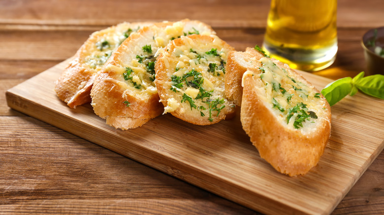 Garlic bread on cutting board