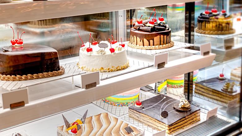 Bakery case with cakes on display