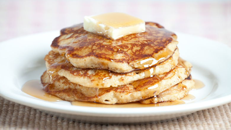 A sack of fluffy pancakes on a plate