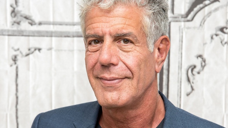 Close-up photo of Anthony Bourdain with a soft smile