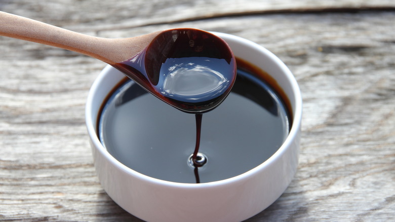 Molasses dripping off a spoon