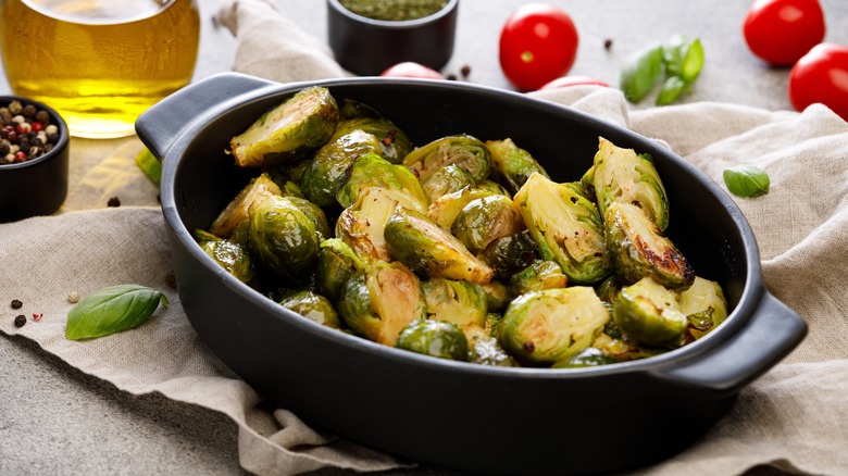 An iron pan full of cooked Brussels sprouts