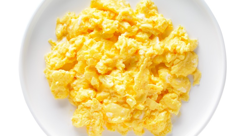 Scrambled eggs on a white plate