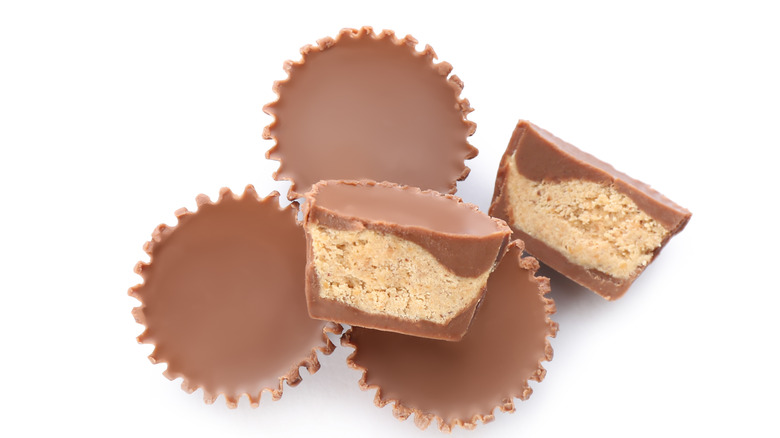 whole and halved chocolate peanut butter cups