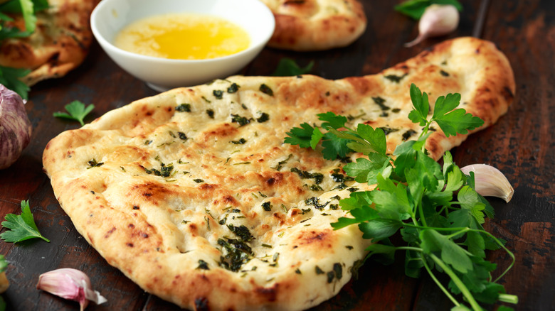 naan bread with melted butter and herbs