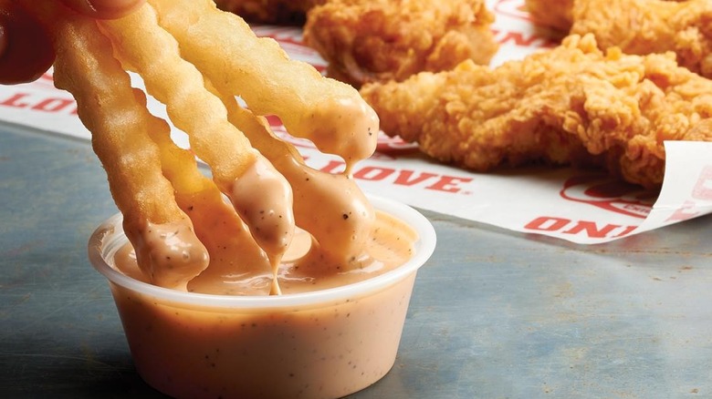 fries dipped in Cane's Sauce