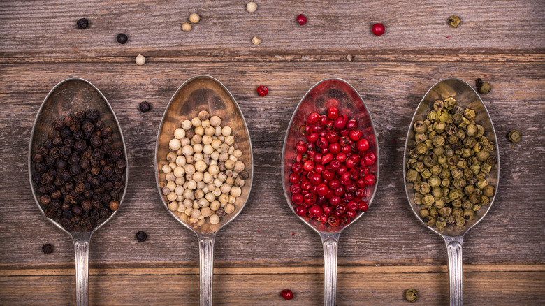 various whole peppercorns