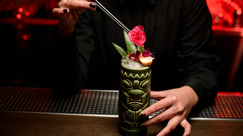 garnishing a tiki cocktail