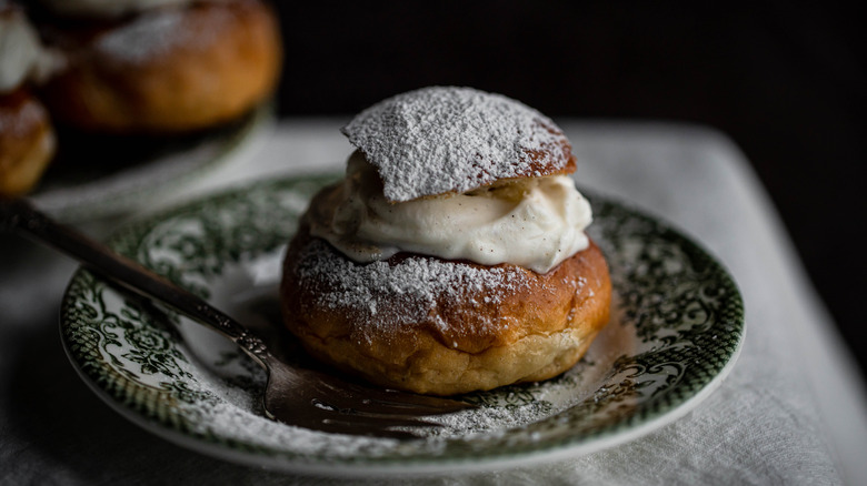 Semla on a plate with fork